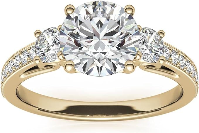 Moissanite Color: Yellow Gold round three-stone design with accents. Main stone: 1 carat, 2 side stone: 0.5 carat, surrounded by some small moissanite.