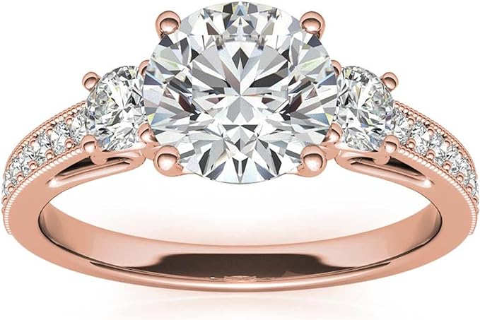 Moissanite Color: Rose Gold round three-stone design with accents. Main stone: 1 carat, 2 side stone: 0.5 carat, surrounded by some small moissanite.